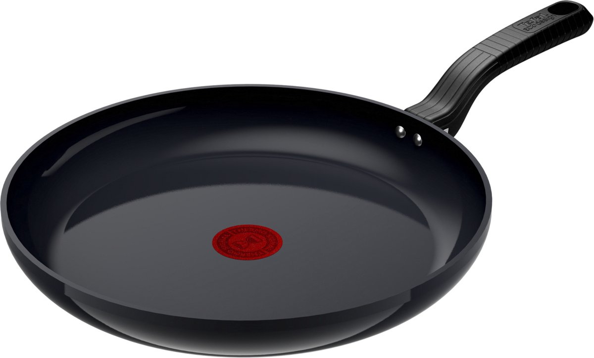Zwarte koekenpan met rode warmte-indicator.