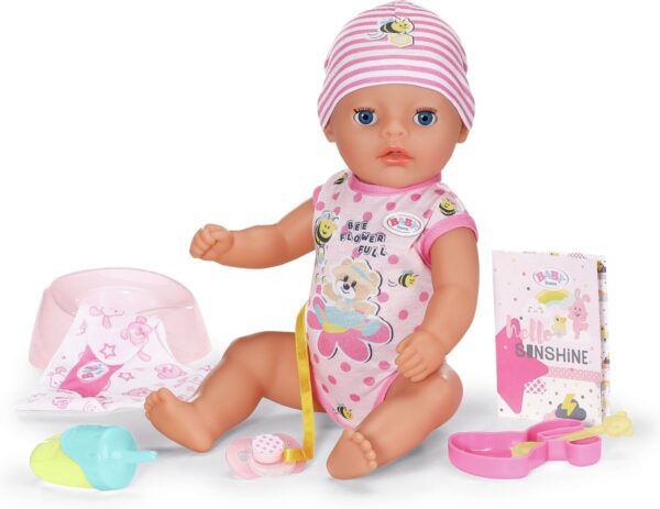 Baby pop met accessoires en roze kleding