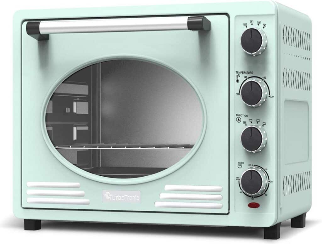 Mintgroene retro oven met draaiknoppen en glazen deur.