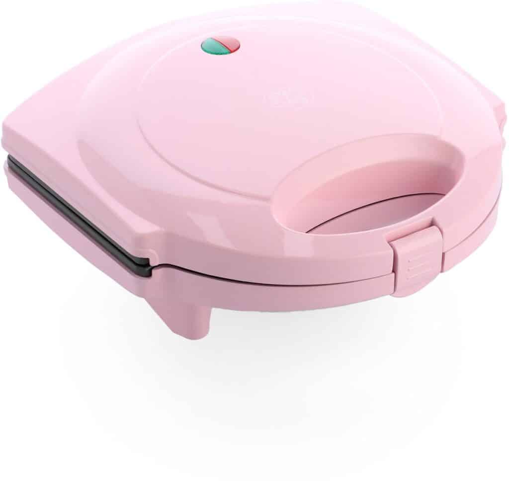 Roze sandwichmaker met handgreep en indicatielampjes.