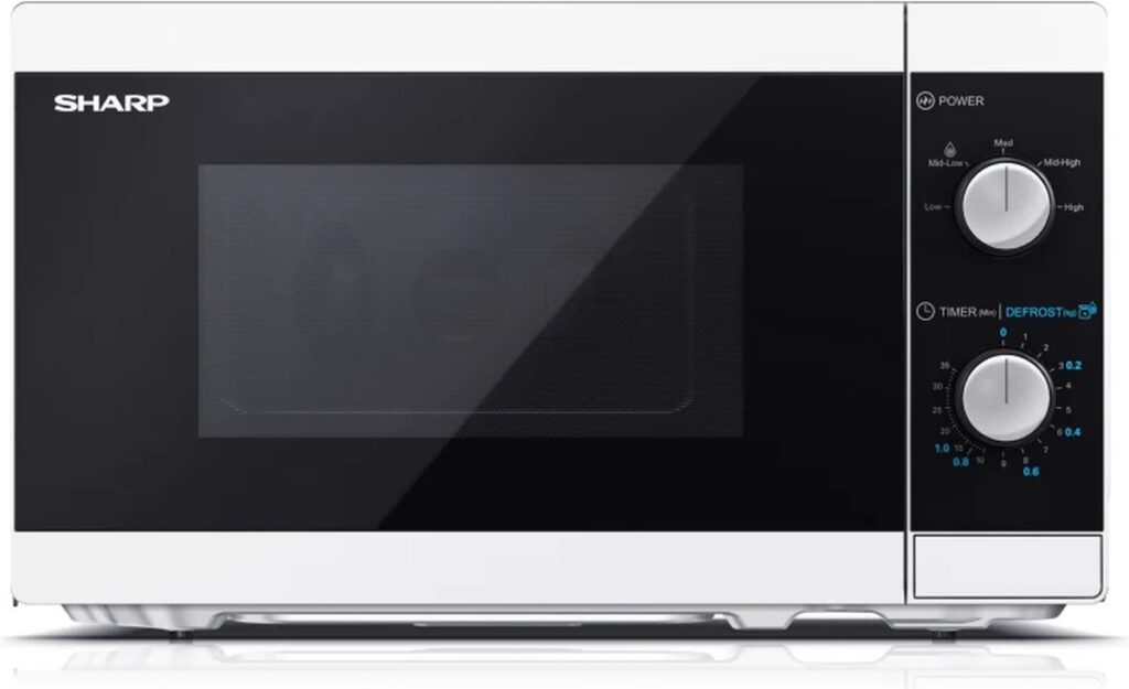 Witte magnetron met draaiknoppen en zwarte deur