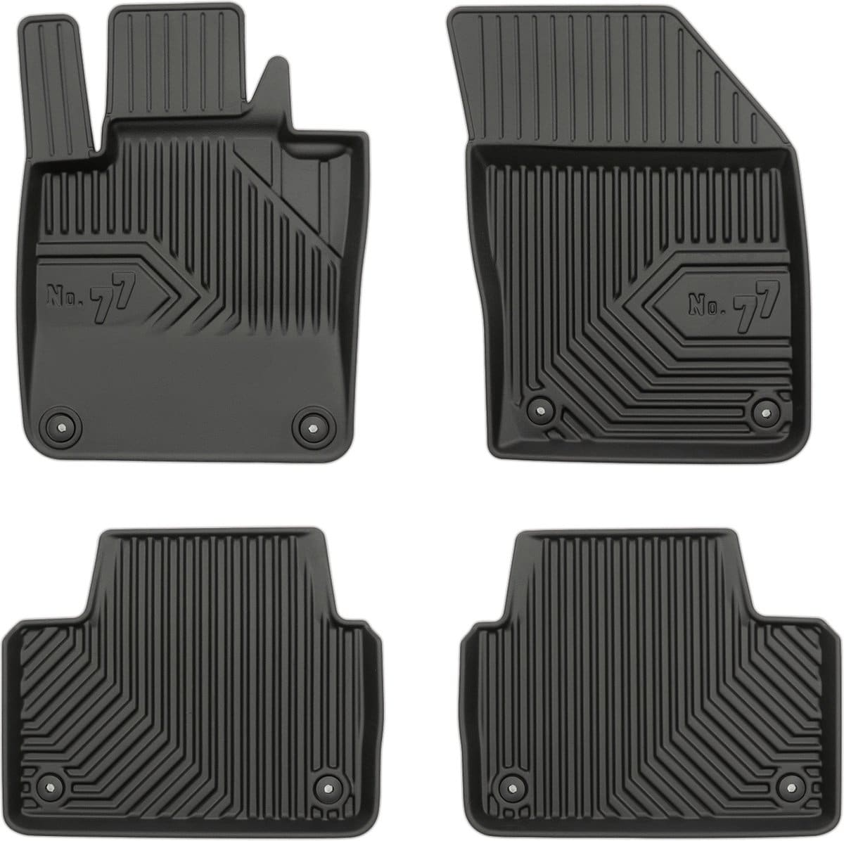 Vier zwarte rubberen automatten op witte achtergrond.