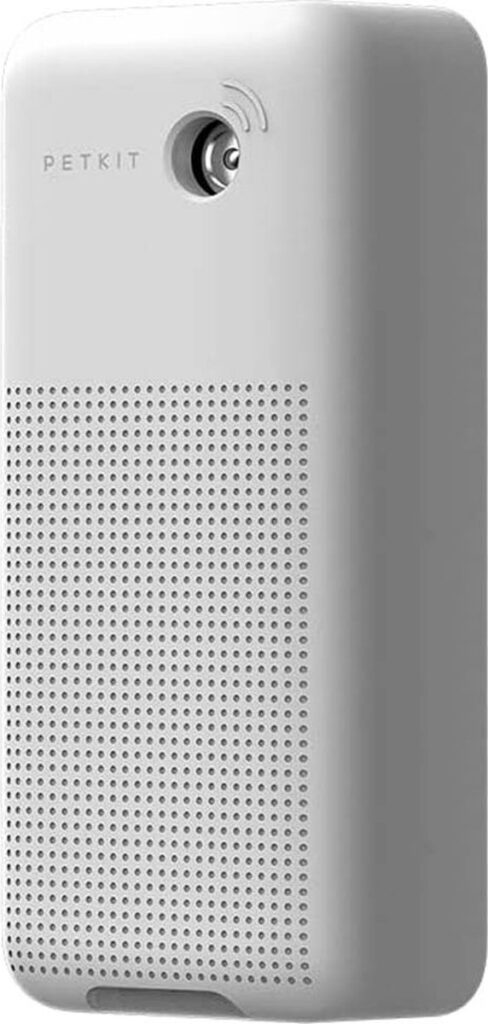 Wit elektronisch apparaat met rooster en knop bovenaan.