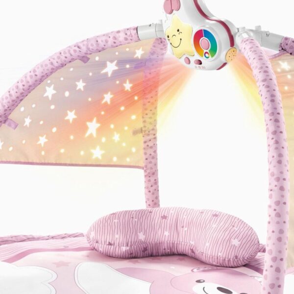 Roze baby speelmat met sterrenlichtprojectie.