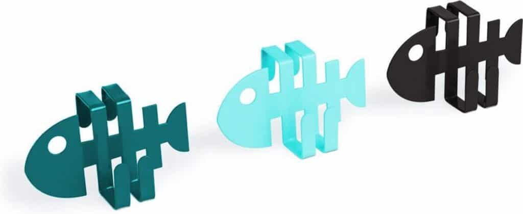 Drie kleurrijke visvormige boekensteunen