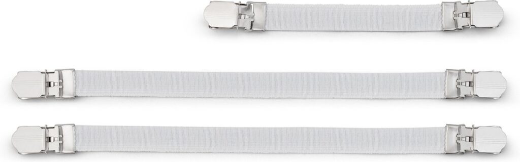 Drie witte bedlakenspanners met metalen clips