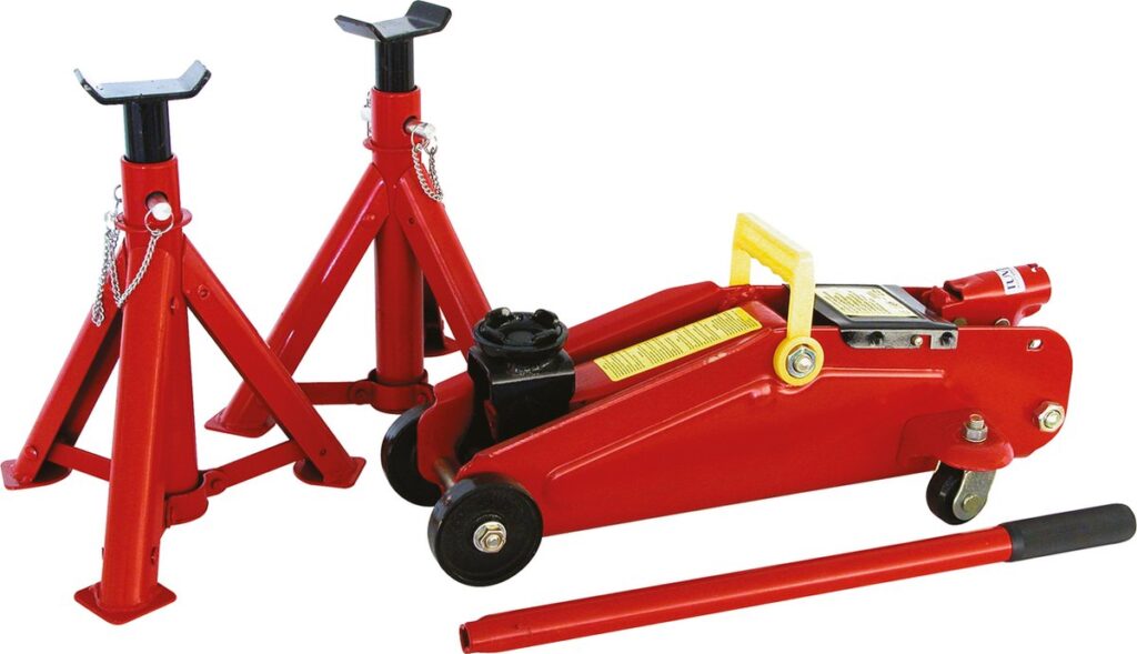 Red hydraulic jack with axle supports