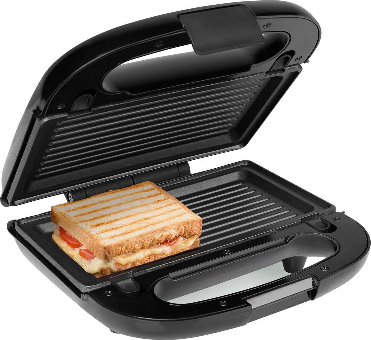 Tosti-ijzer met tosti kaas en tomaat binnenin.