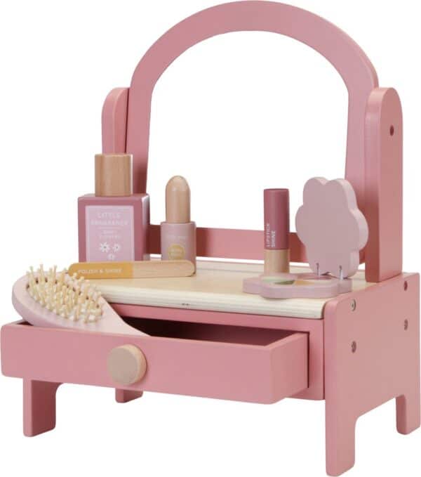 Roze speelgoedkaptafel met accessoires voor kinderen.