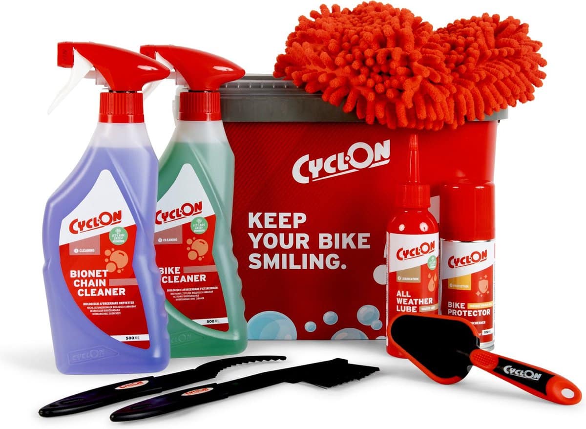 Bike maintenance products and cleaning kit in bucket.