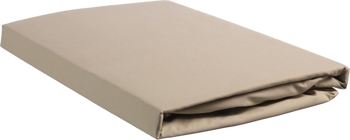 Beige folded mattress on a white background