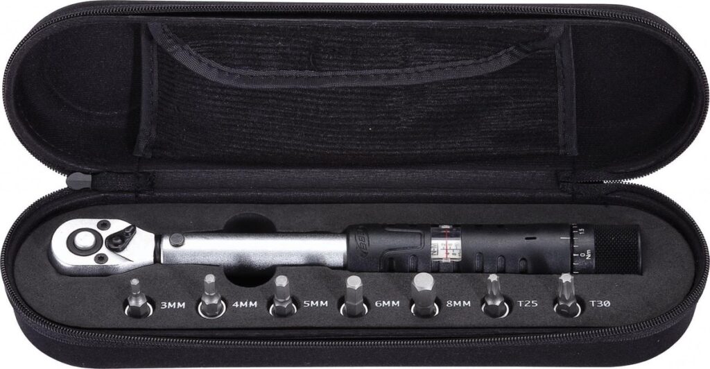 Torque wrench set in carrying case with various sockets.