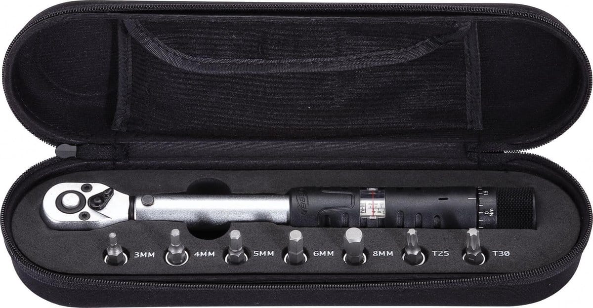 Torque wrench set in carrying case with various sockets.