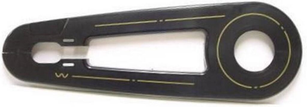 Black metal sewing machine stitch plate with an opening