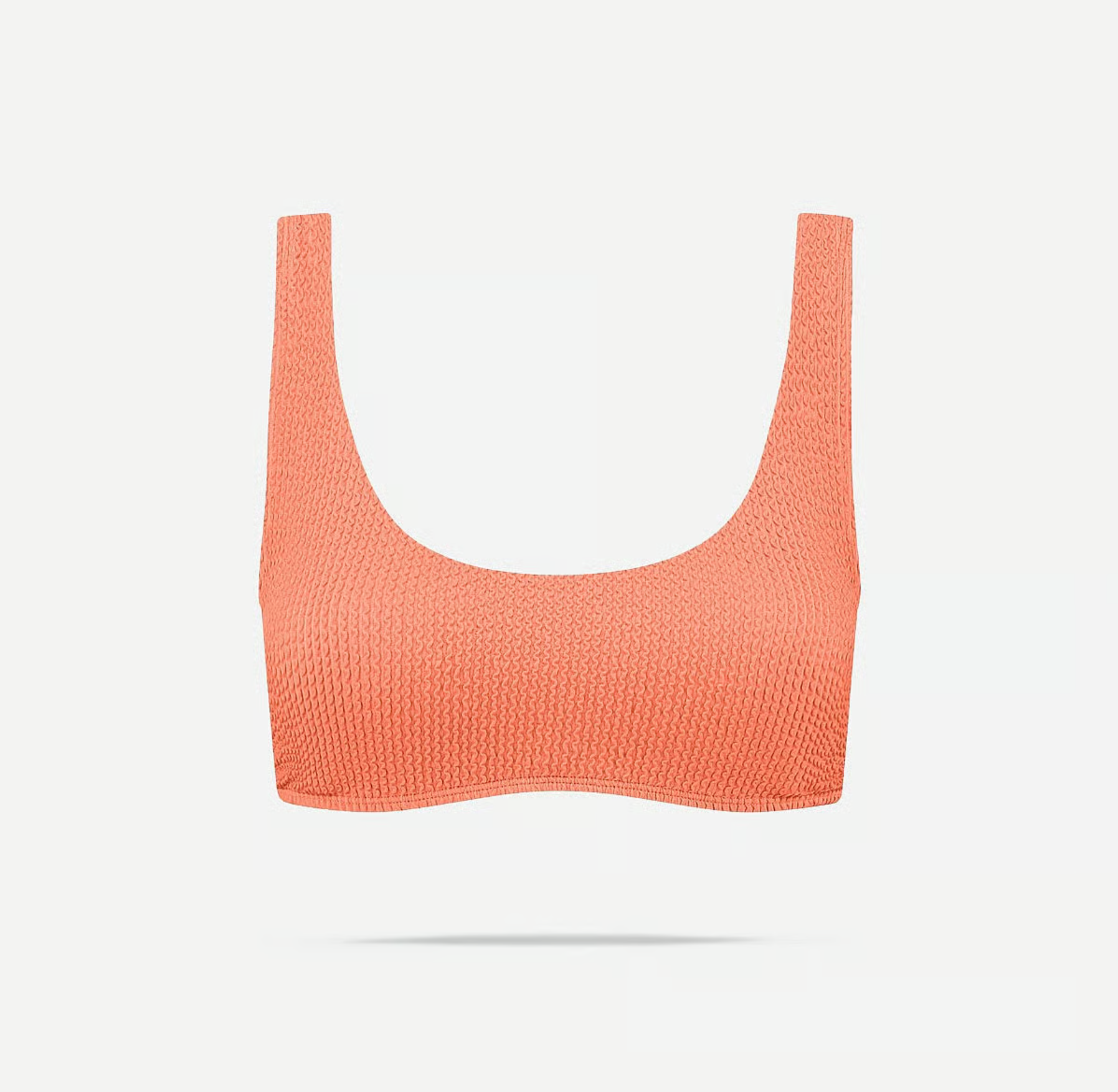 Oranje gestructureerde sport-bh op witte achtergrond