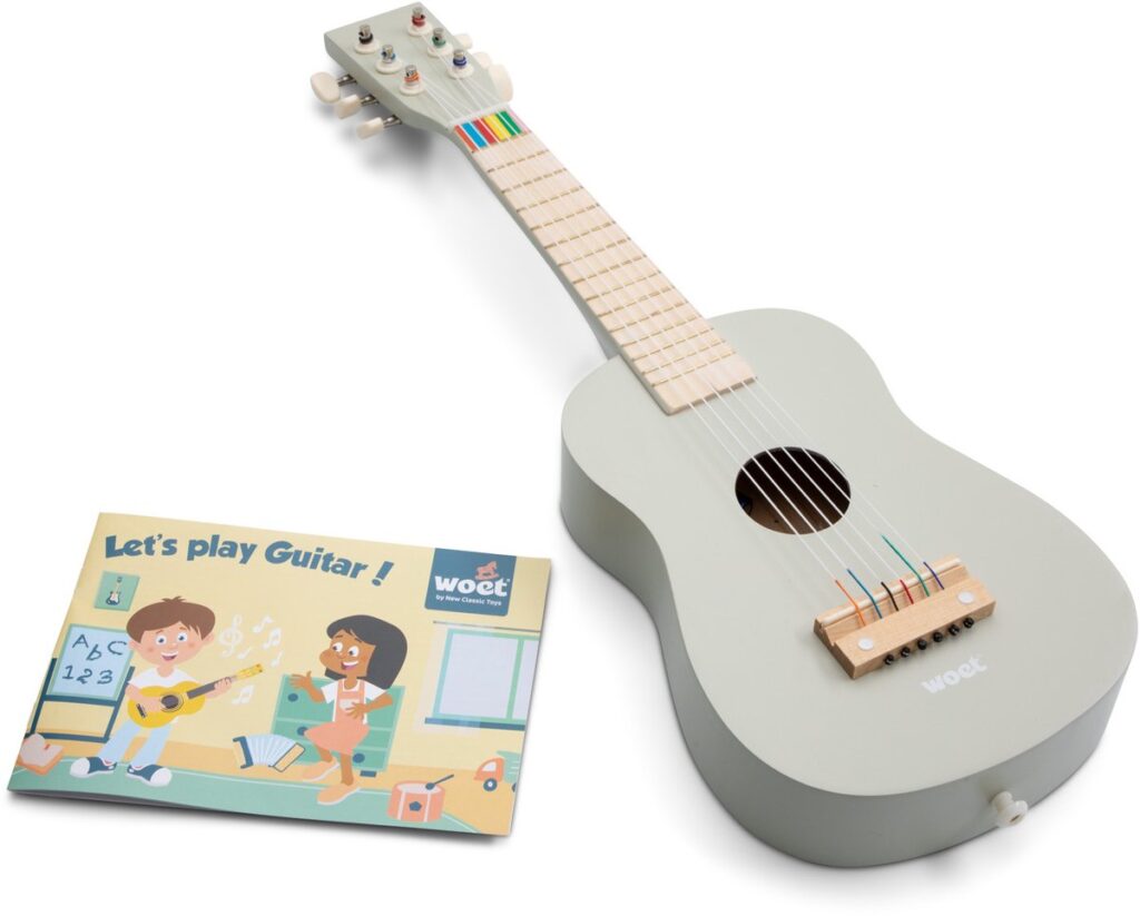 Children's toy guitar with instruction booklet