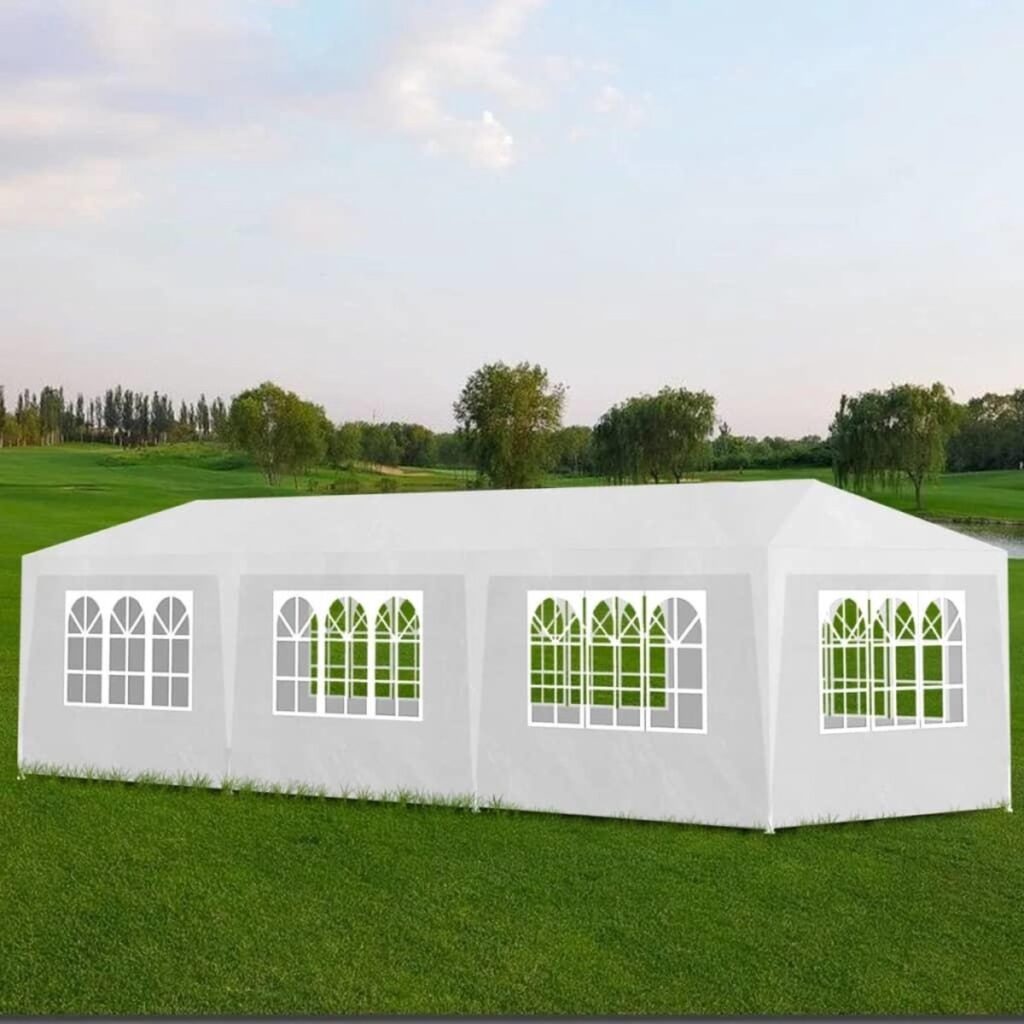 Witte partytent in groene tuinomgeving