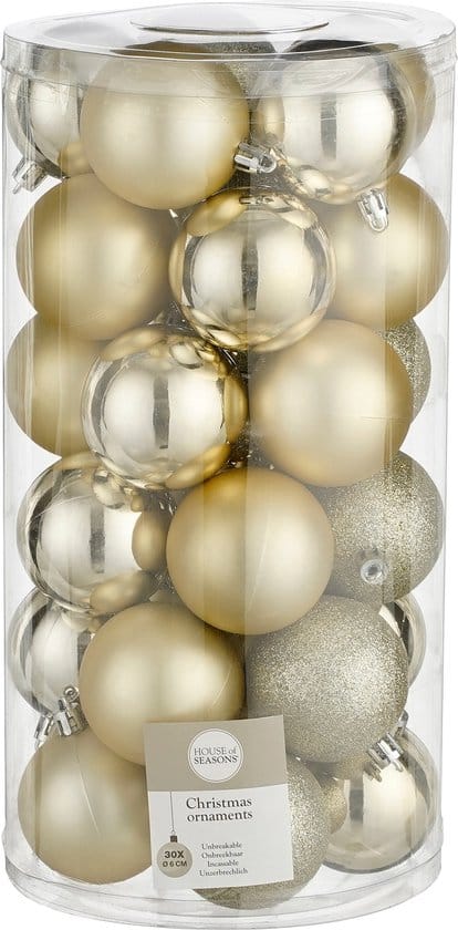 Doorzichtige doos met gouden kerstballen.