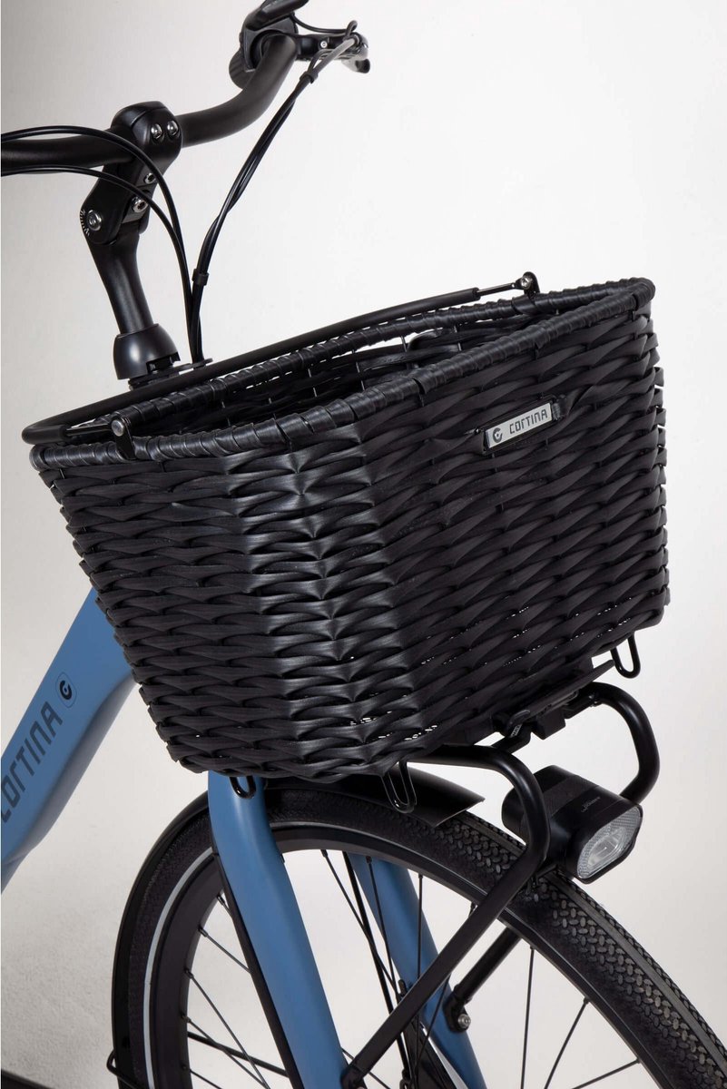 Black bike basket on a blue bike