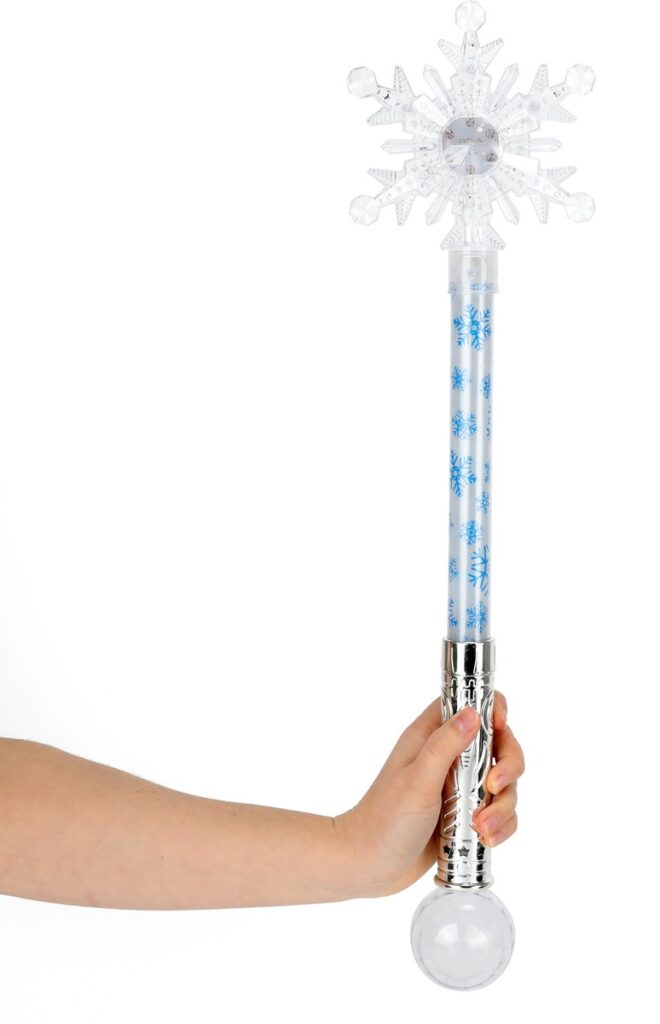 Hand met sneeuwvlok toverstaf met licht
