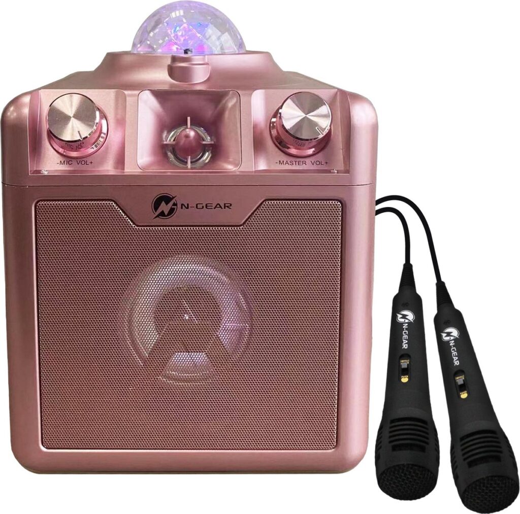 Roze karaoke-speaker met microfoons.