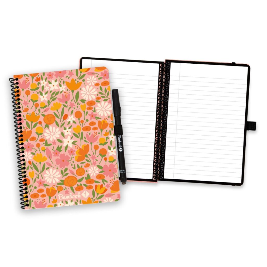 Floral spiral notebook and open notebook with a pen