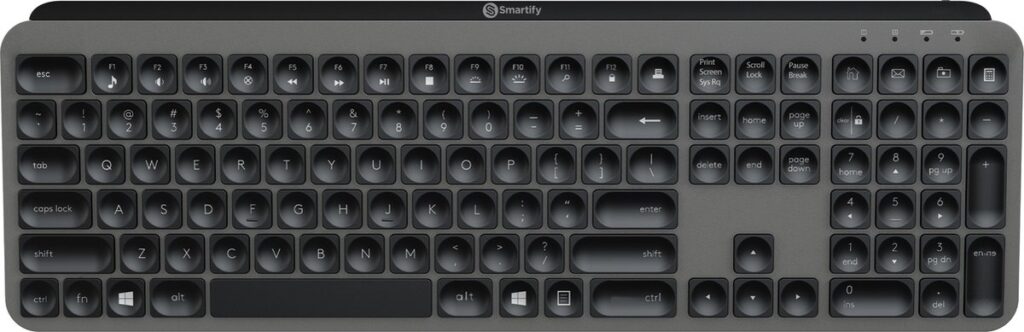 Draadloos toetsenbord met nummeriek pad en mediaknoppen.