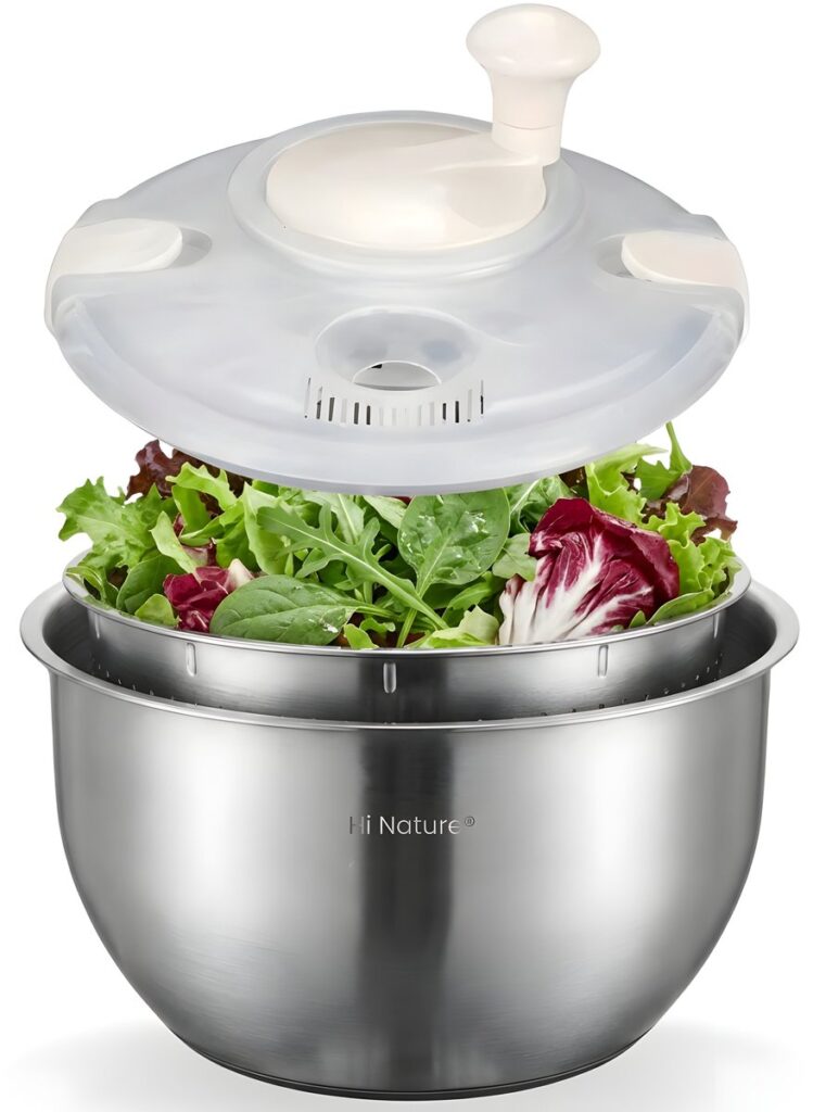 Stainless steel salad spinner with fresh mixed lettuce