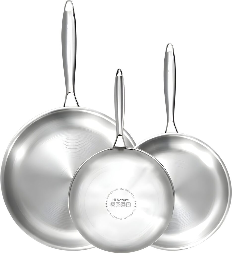Three stainless steel frying pans in different sizes