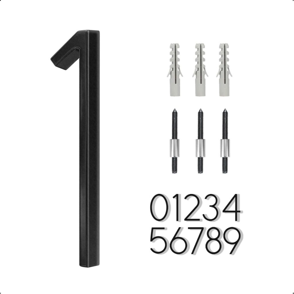 Zwarte huisnummer drie met montageaccessoires