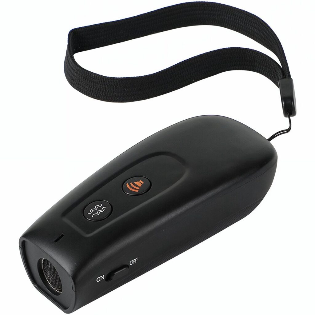 Draagbare ultrasone hondenafschrikker met polsband en knoppen.