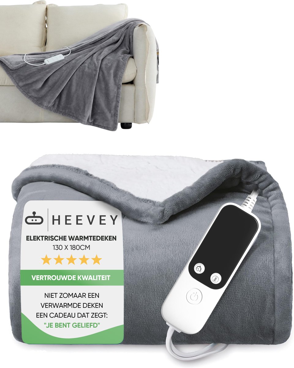 Grijze elektrische warmtedeken met bediening op bank.