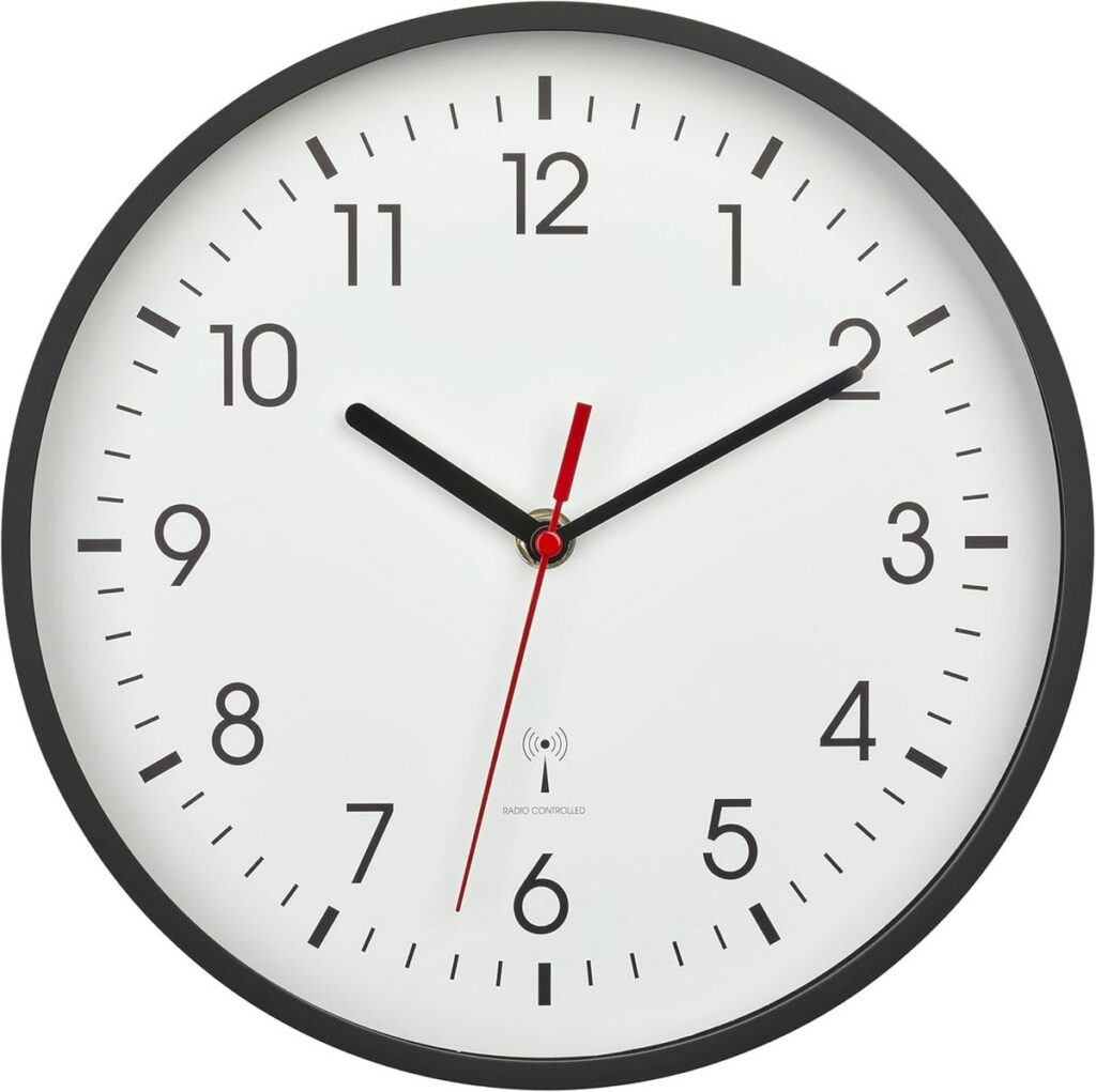 Wall clock with hands at eleven o'clock eight minutes.