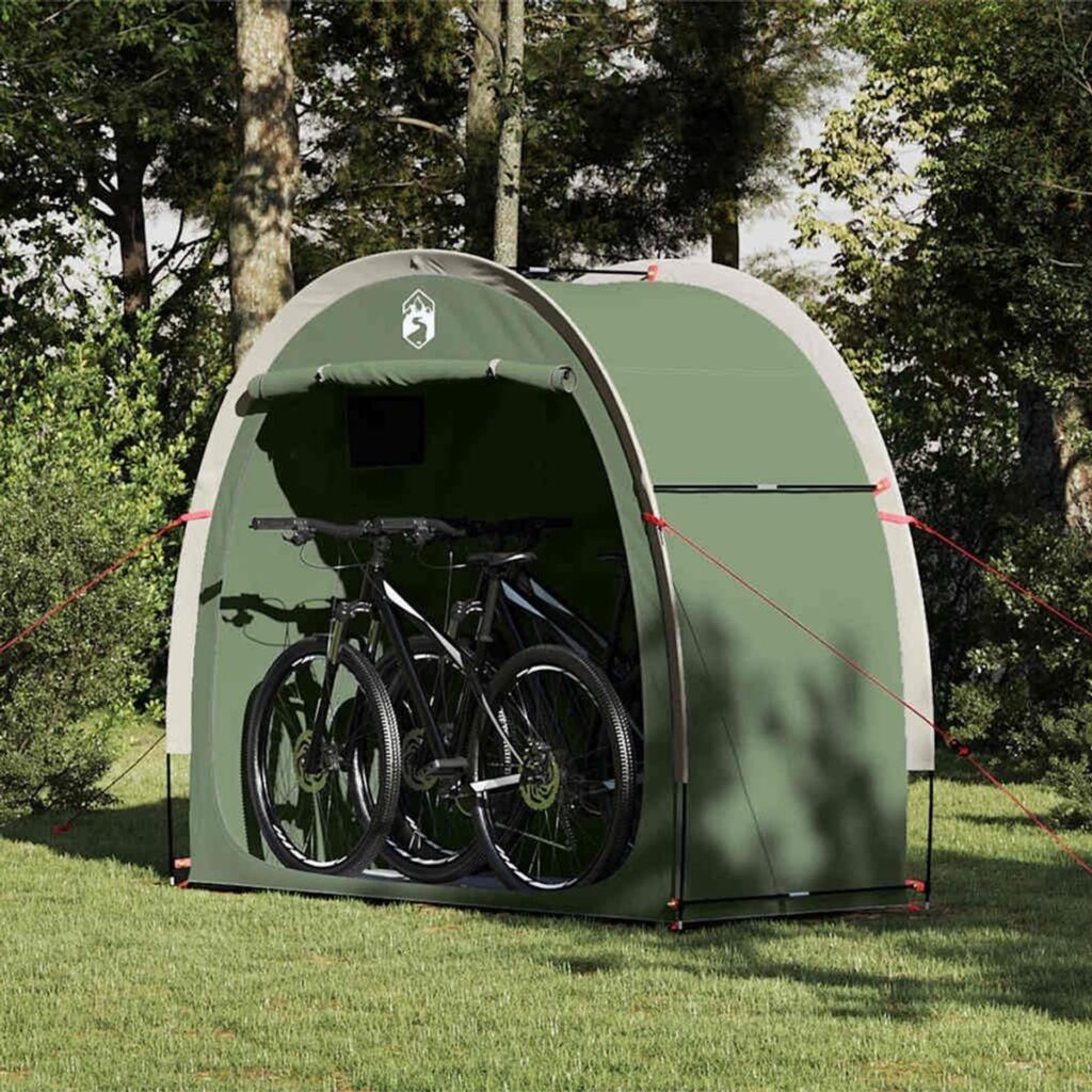 Groene fietsentent met twee fietsen in tuin