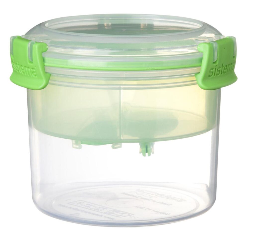 Transparante ronde bewaardoos met groene clips
