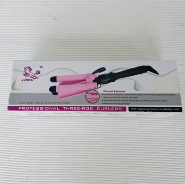 Doos met driepoot krultang, roze en zwart.